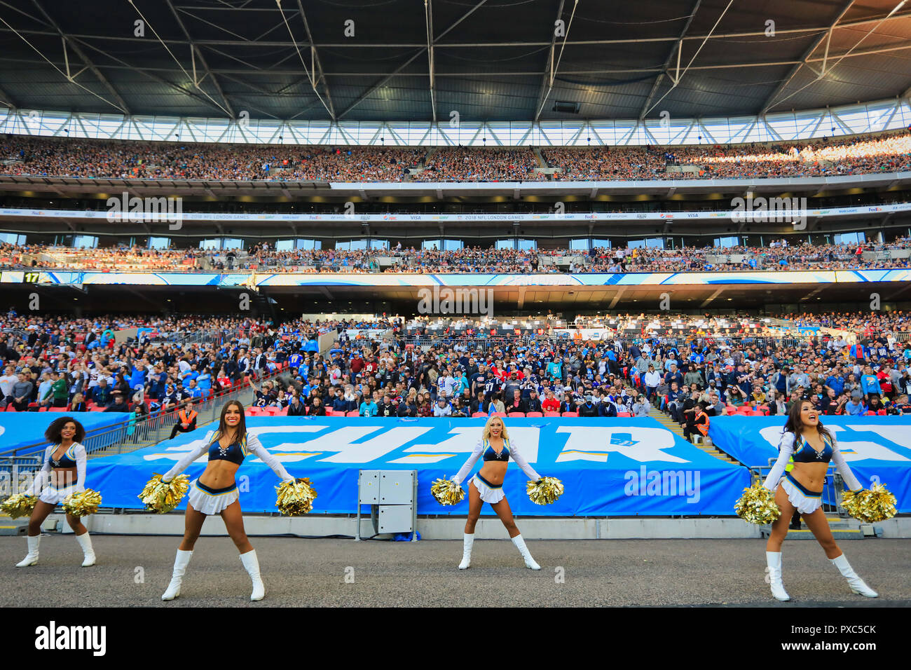 Wembley Stadium, London, UK. 21st Oct, 2018. NFL in London, game two, Tennessee Titans versus Los Angeles Chargers; Los Angeles Chargers Cheerleaders entertain the Wembley crowd Credit: Action Plus Sports/Alamy Live News Stock Photo
