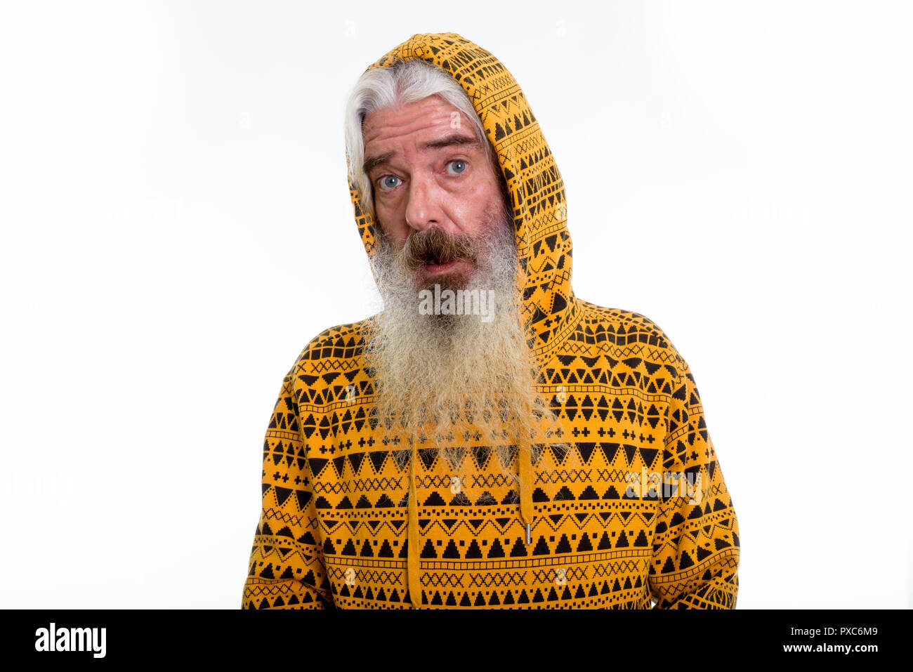 Studio shot of senior bearded man wearing hoodie and looking sho Stock Photo