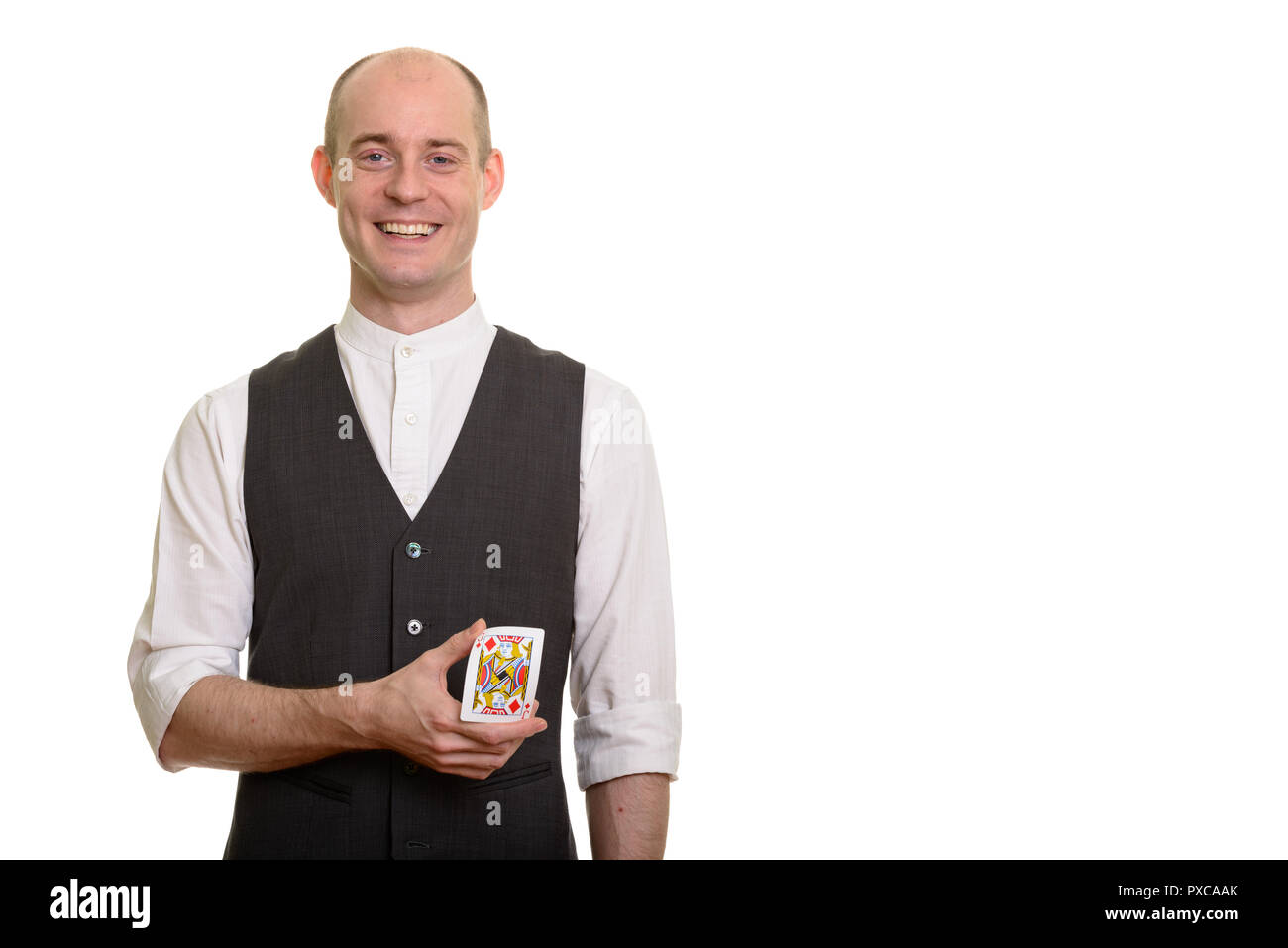 Happy bald Caucasian magician man smiling and bending Jack of Di Stock Photo
