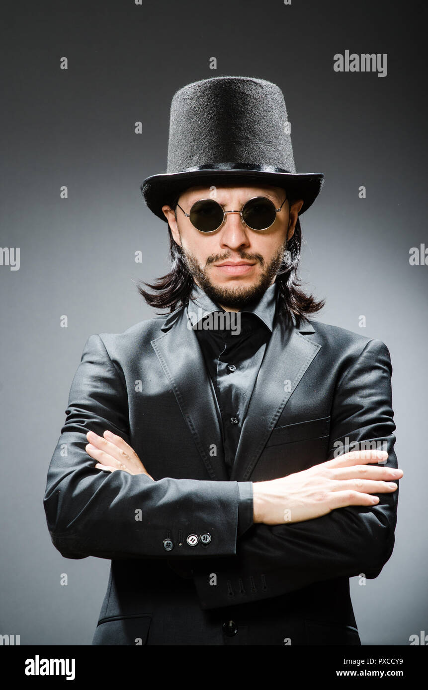 Vintage concept with man wearing black top hat Stock Photo - Alamy