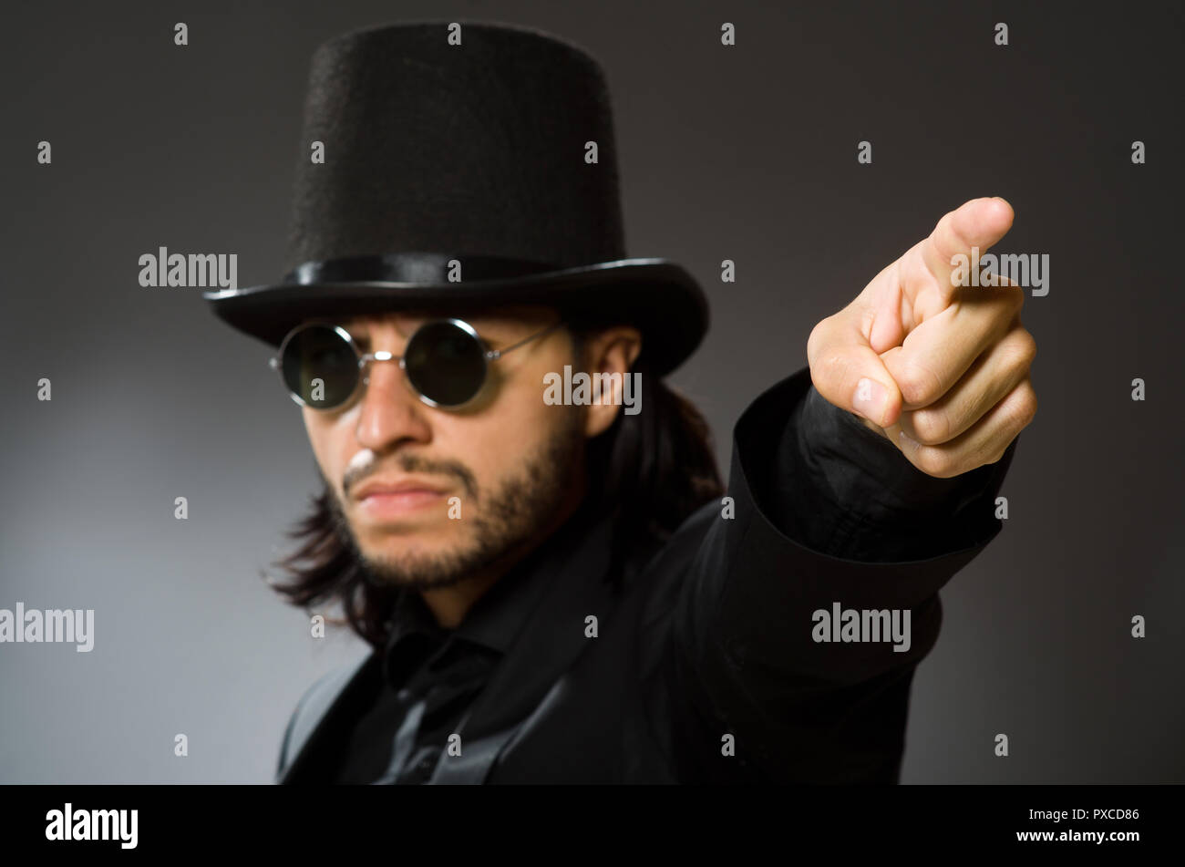 Vintage concept with man wearing black top hat Stock Photo - Alamy
