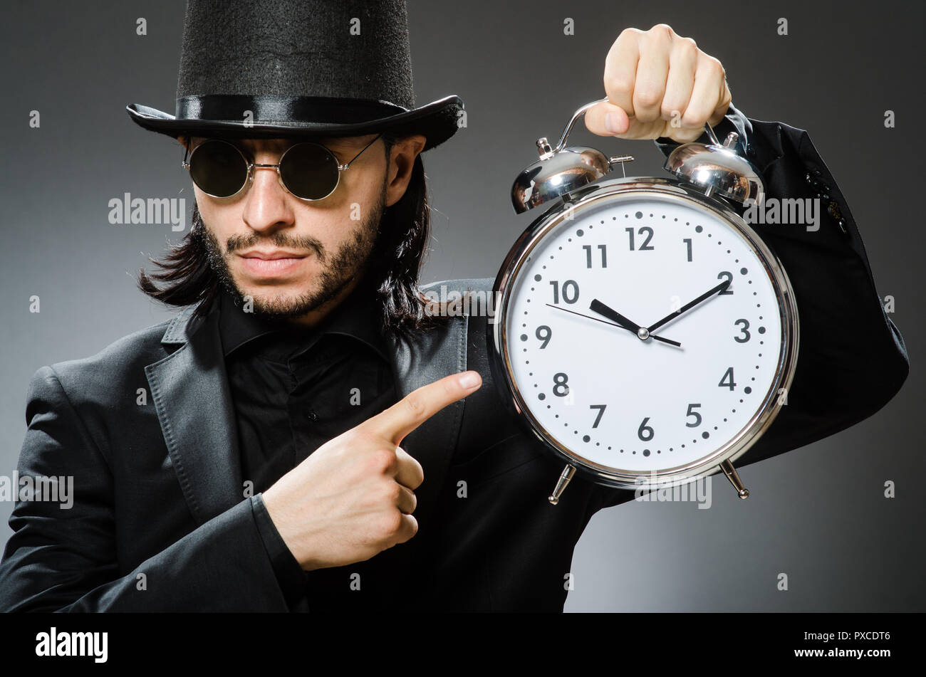 Vintage concept with man wearing black top hat Stock Photo - Alamy