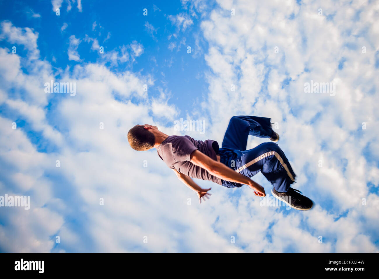 Man trains parkour while jumping in the air Stock Photo Alamy