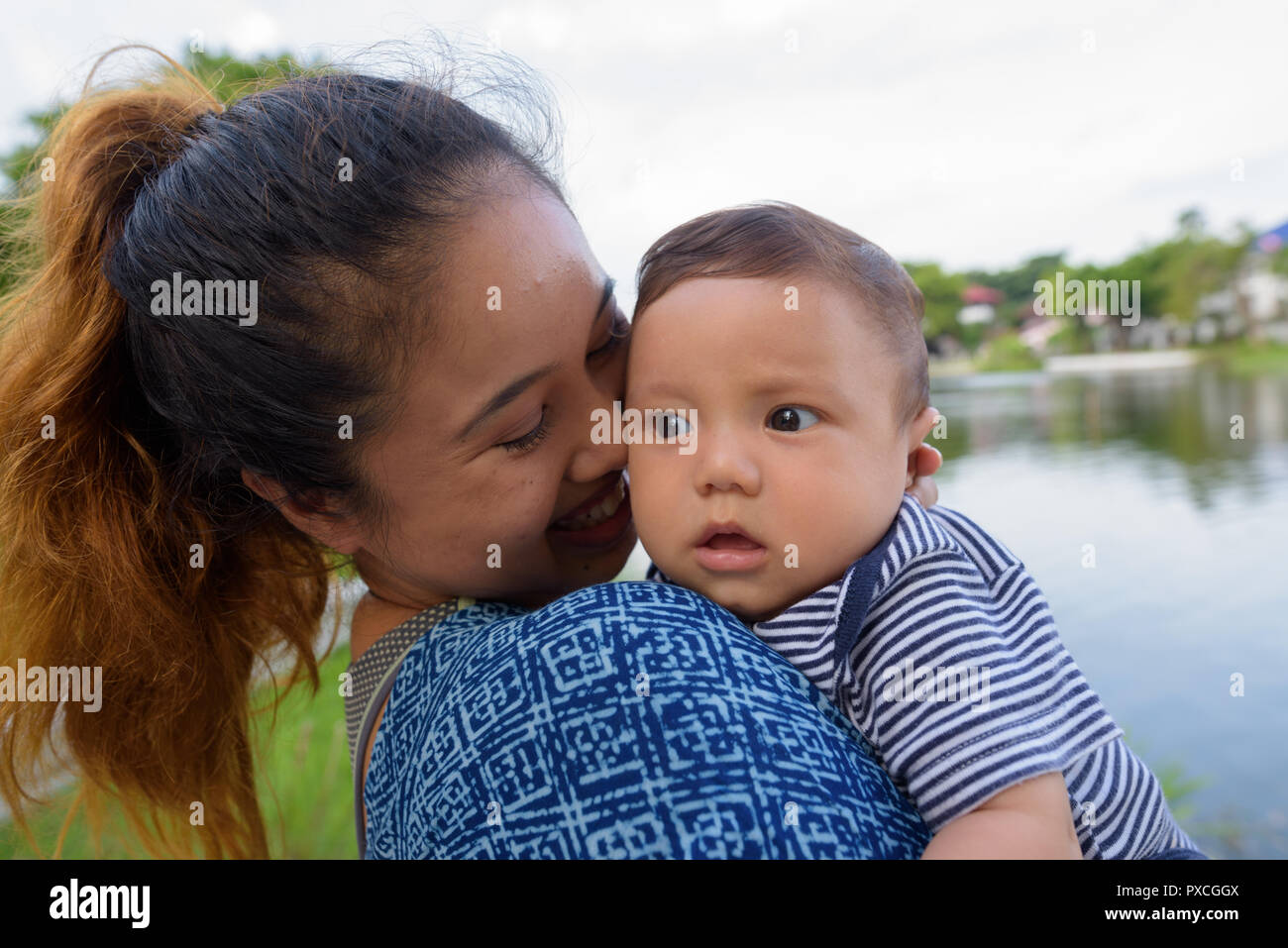 Mother and baby son bonding together at the park Stock Photo