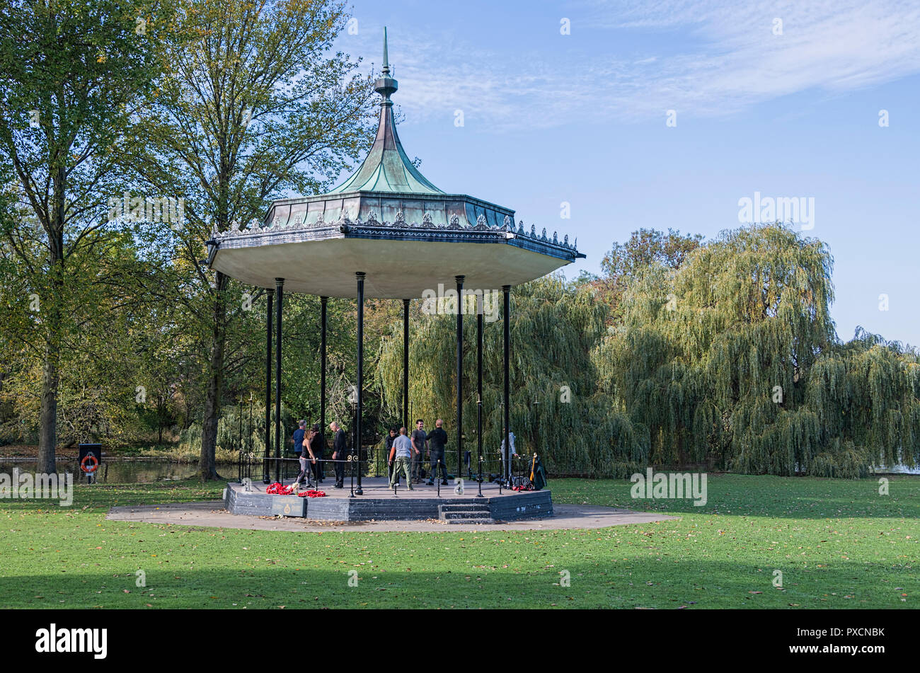 Bandstand by the lake in Regents Park London UK with people exercising within Stock Photo