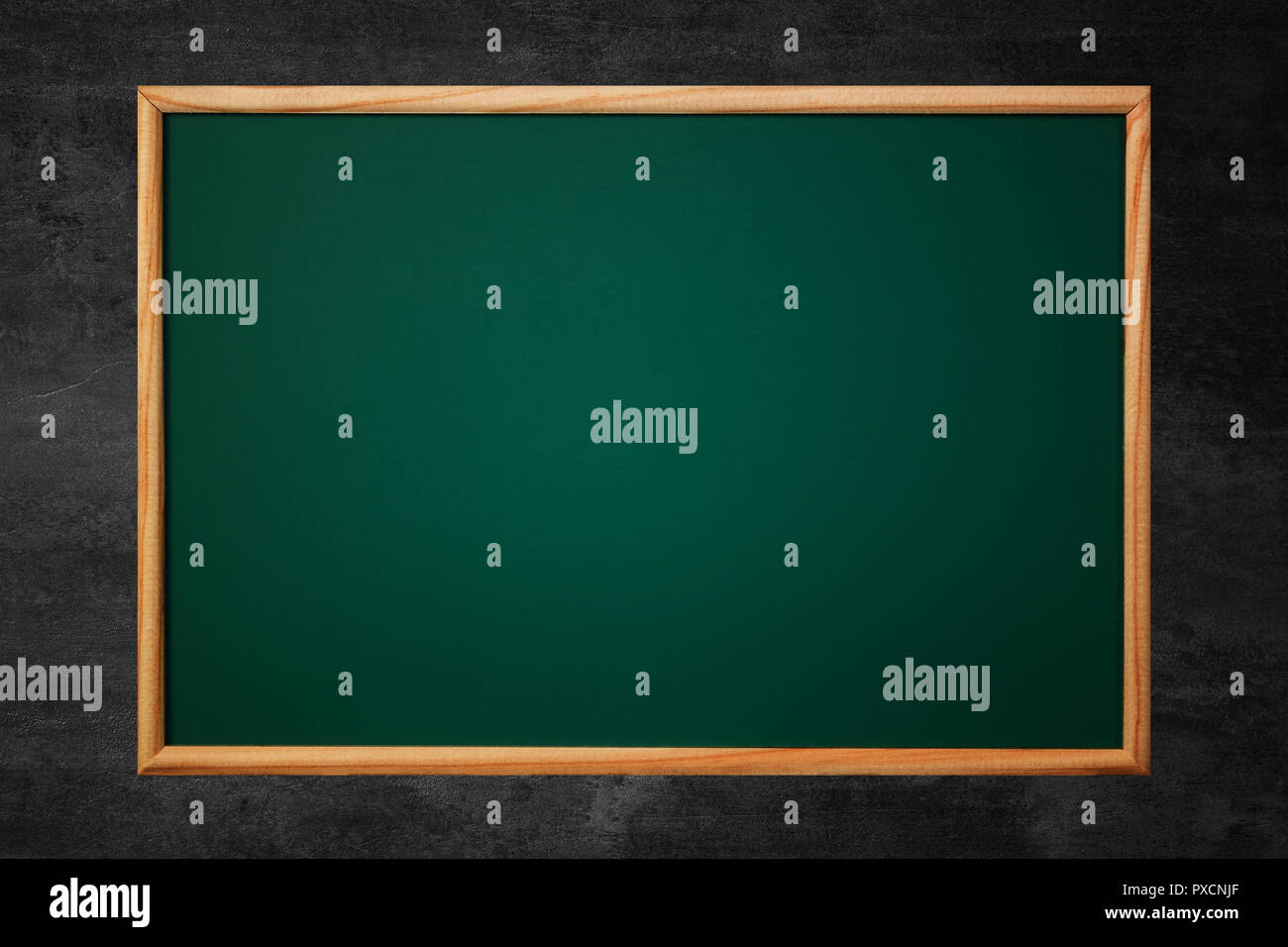 Empty green chalkboard or school board background and texture with wood ...