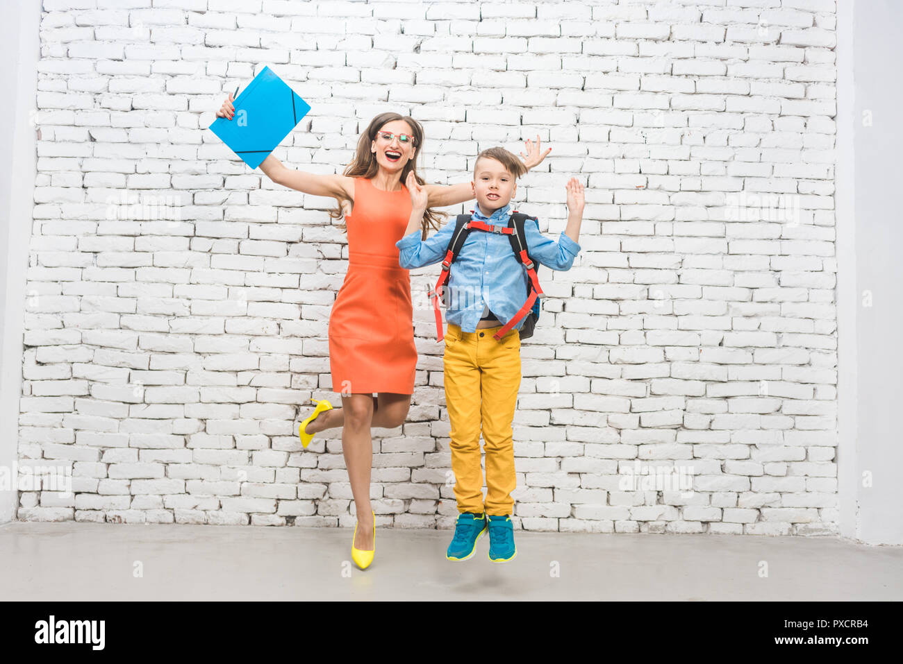 Student or pupil and teacher being excited about school  Stock Photo