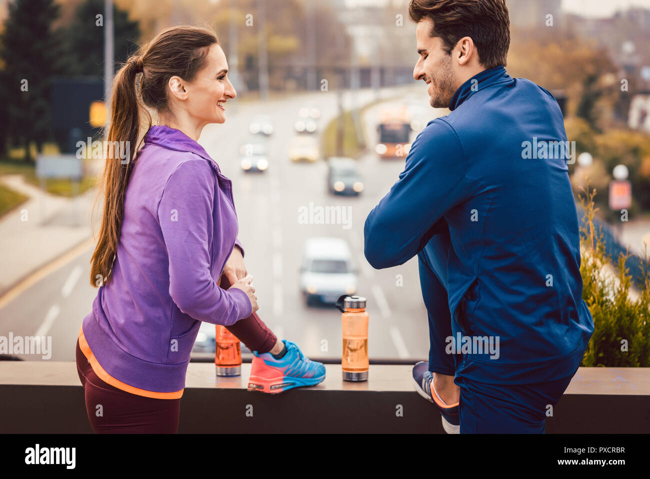 Athletic couple exercising for better fitness in the city Stock Photo