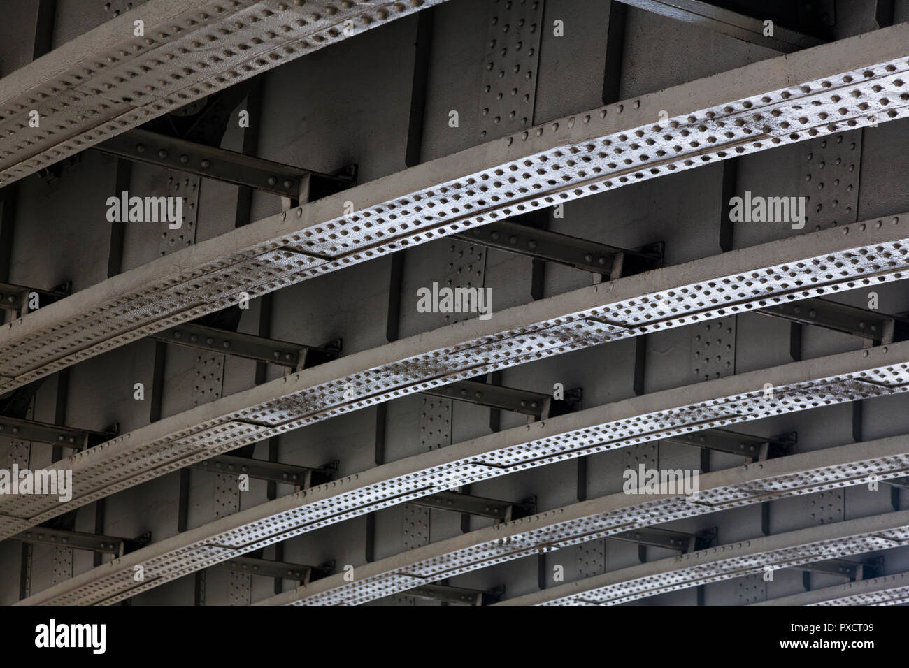 Exposed structural steelwork beneath a bridge, London, UK. Stock Photo
