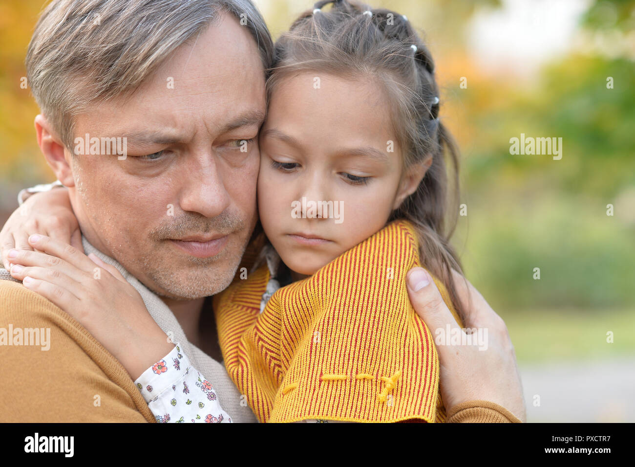 Portrait of father and daughter outdoors in autumn park Stock Photo - Alamy