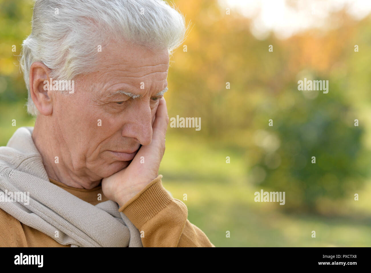 Portrait of a sad senior man outdoors Stock Photo