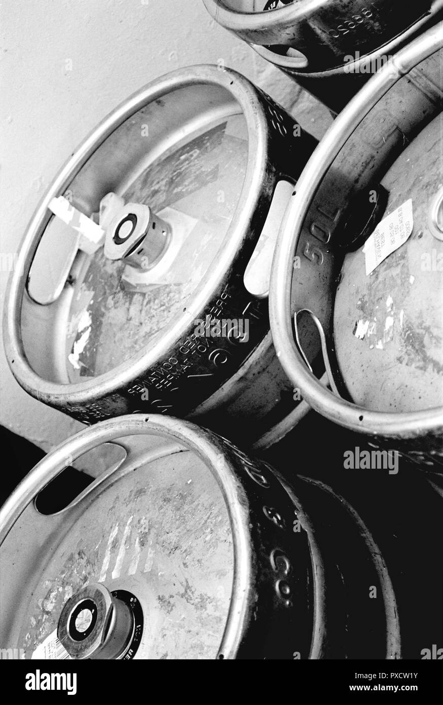 Steel metal beer kegs outside a Glasgow pub. This was taken between 2005-2006 on photographic film. Stock Photo