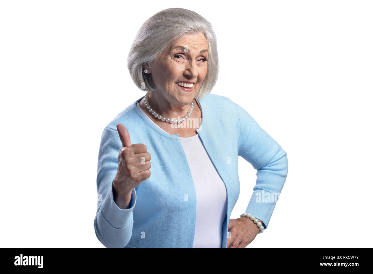 Beautiful senior woman showing thumb up on white background Stock Photo ...