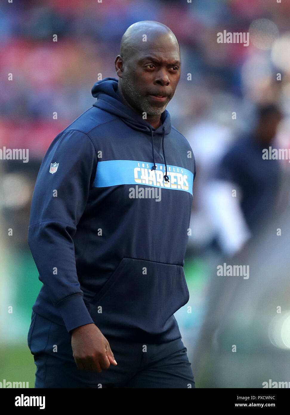 LA Chargers head coach Anthony Lynn watches warm up prior to the  International Series NFL match at Wembley Stadium, London Stock Photo -  Alamy