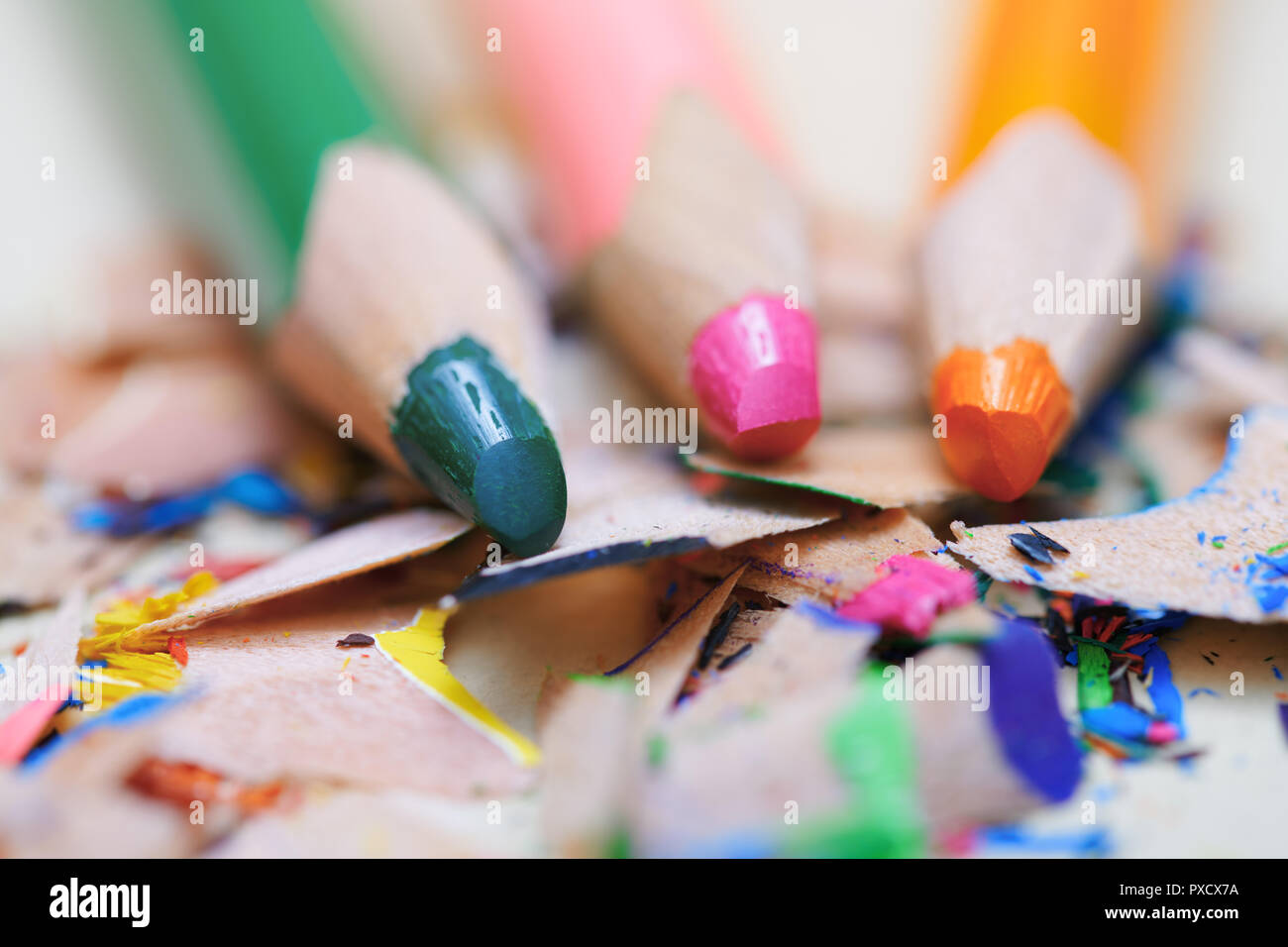 Closeup on sharpened colored pencils with shavings Stock Photo