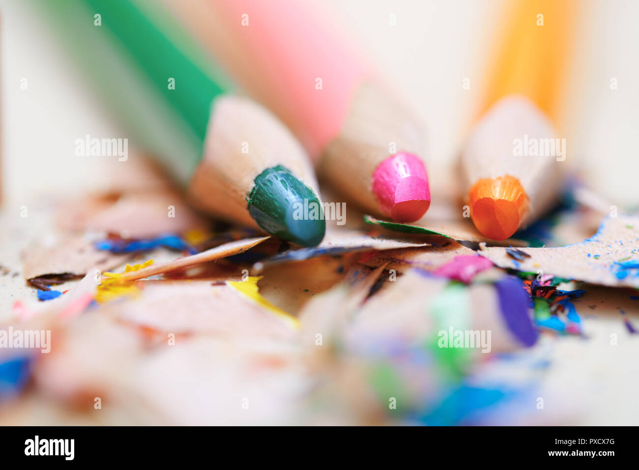Closeup on sharpened colored pencils with shavings Stock Photo