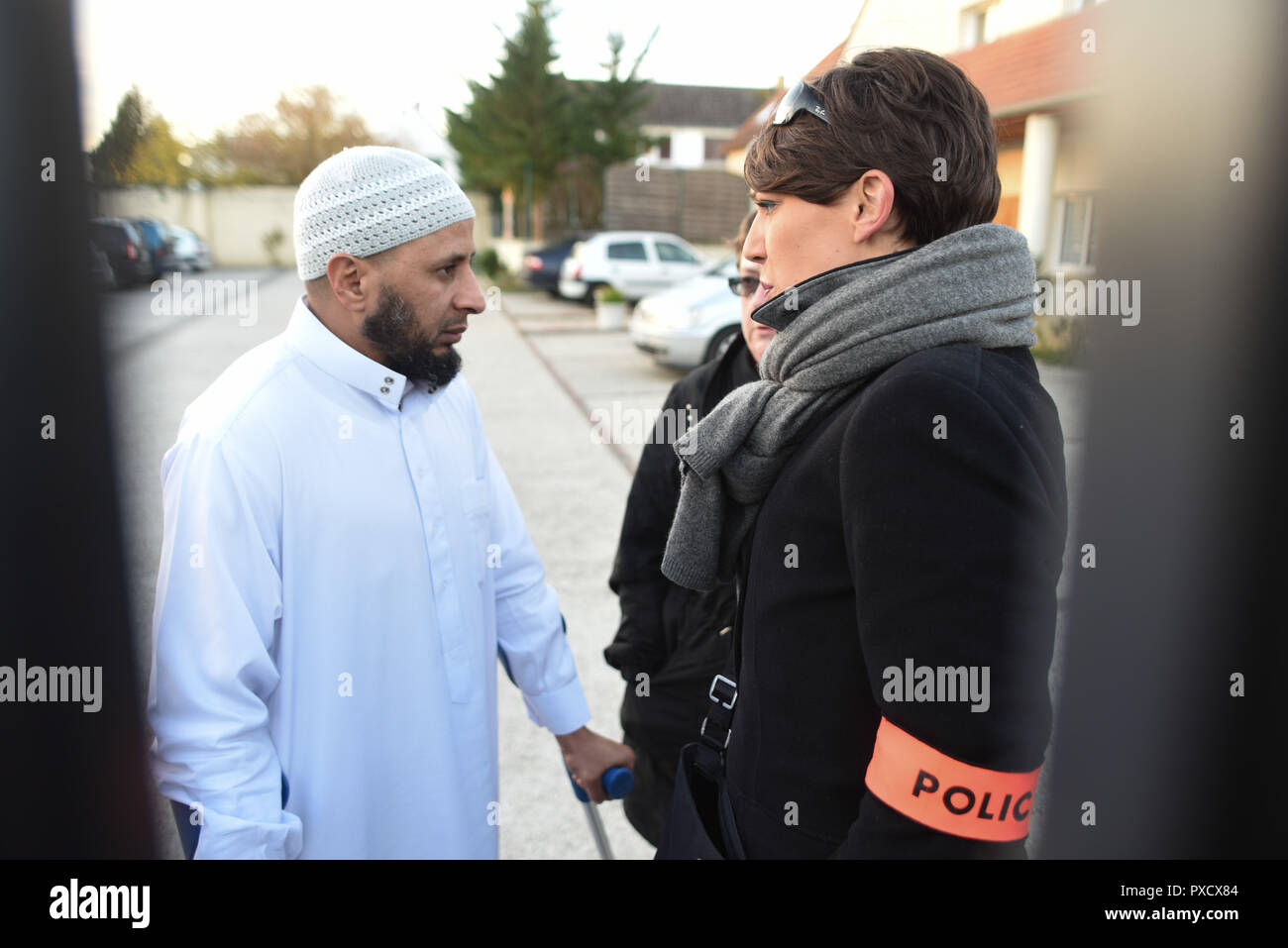 November 15, 2015 - Paris, France: The president of the Luce mosque, Abdallah Benali, talks to a police woman and asks for police protection after his mosque received threats of retaliation over the Paris terror attacks. Benali denied that French terrorist Ismail Omar Mostefai was worshipping regularly here. The mayor of Chartres earlier told that Mostefai became radicalized by attending this mosque before 2010. Des medias du monde entier affluent a la mosquee de Luce, qui a ete frequentee par  Ismail Omar Mostefai, l'un des djihadistes ayant participe a la tuerie du Bataclan. Les responsables Stock Photo