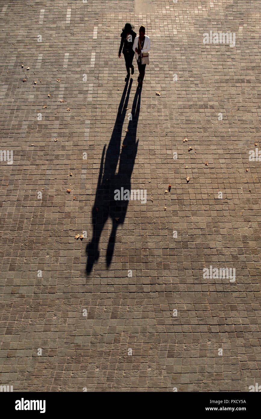 Long shadows cast two people hires stock photography and images Alamy
