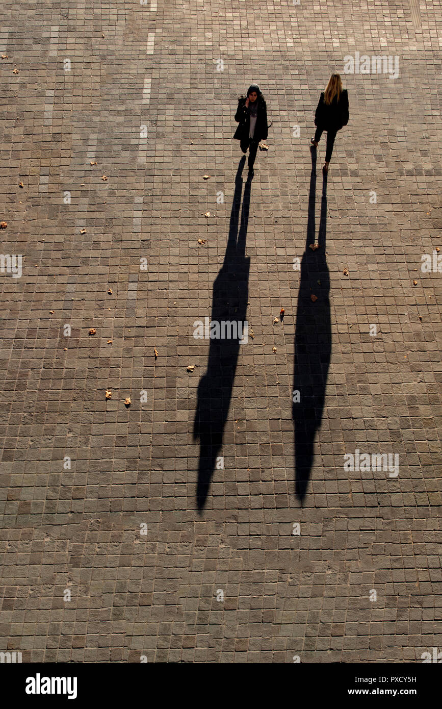 Long shadows cast two people hires stock photography and images Alamy