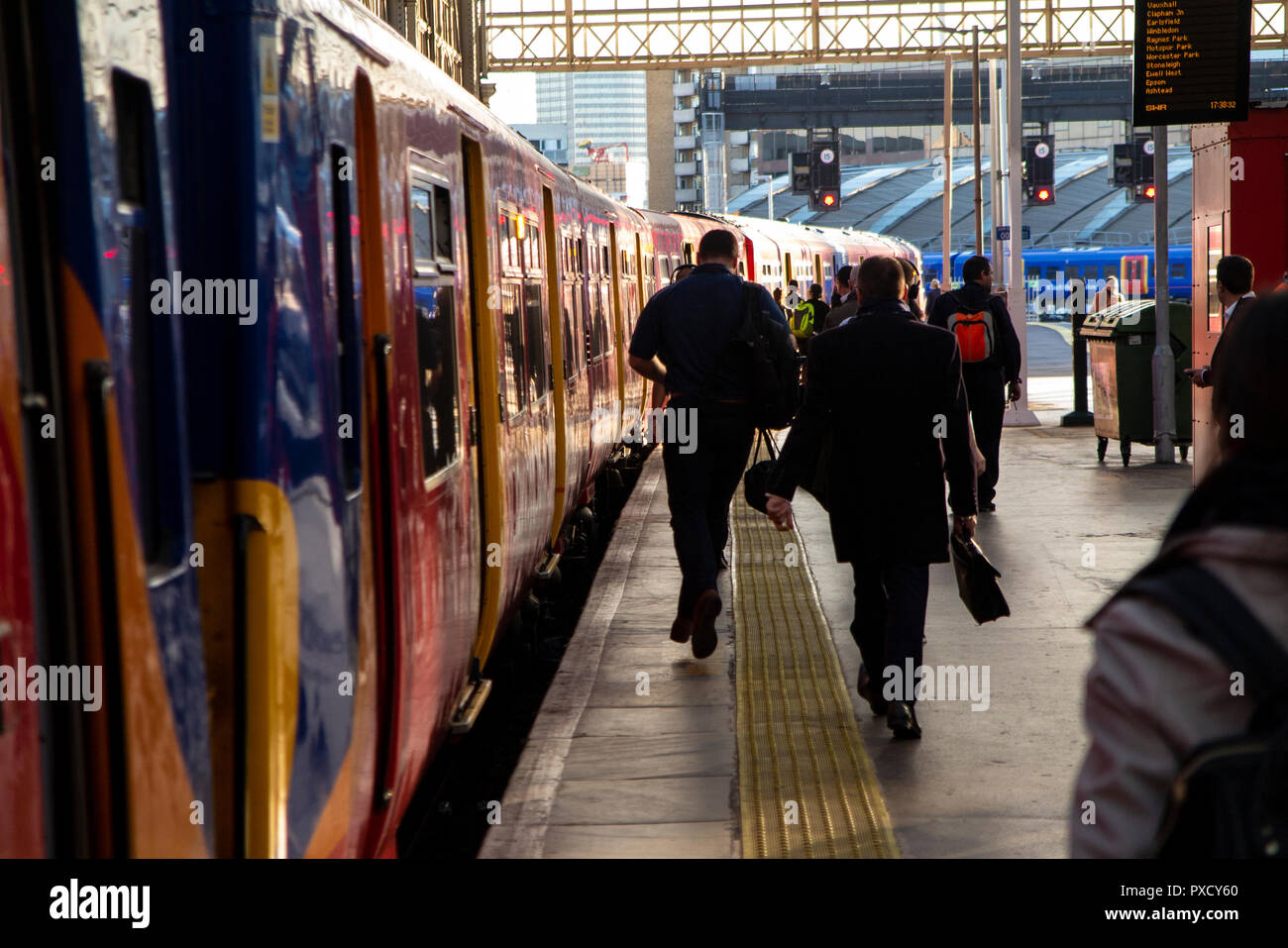 Commuters boarding a South Western train at Waterloo Station Stock Photo