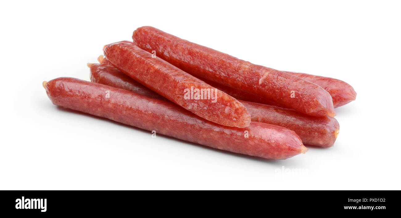 Heap of small smoked sausages isolated on white background Stock Photo