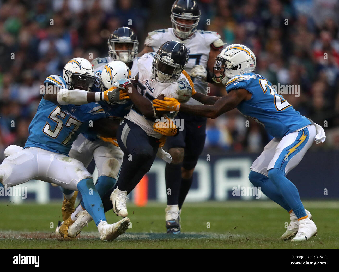 Tennessee Titans' Dion Lewis (centre) is tackled during the ...