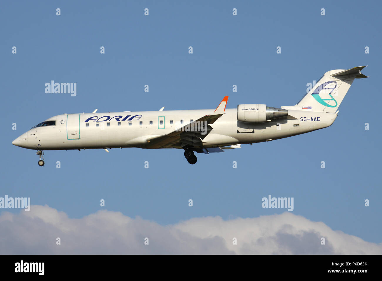 Slovenian Adria Airways Bombardier CRJ200 with registration S5-AAE on short final for runway 01 of Brussels Airport. Stock Photo