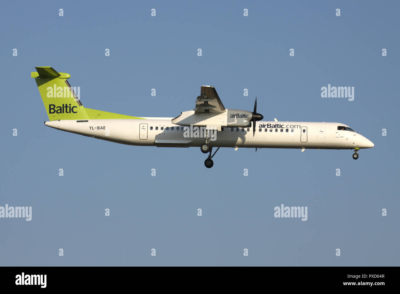Latvian airBaltic Bombardier Dash 8 Q400 with registration YL-BAE on short final for runway 01 of Brussels Airport. Stock Photo