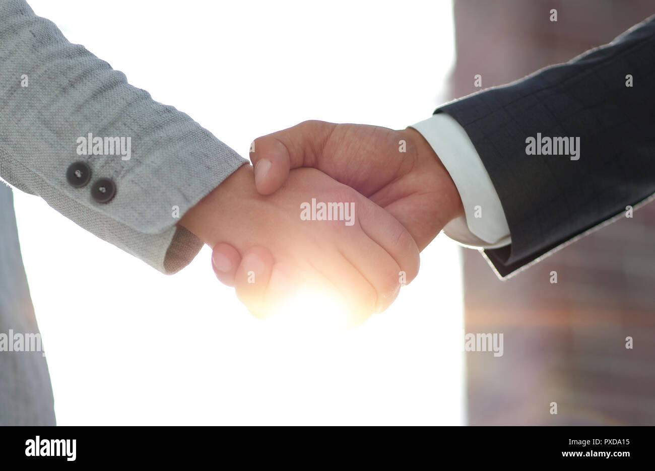 Business people shaking hands isolated on white background Stock Photo