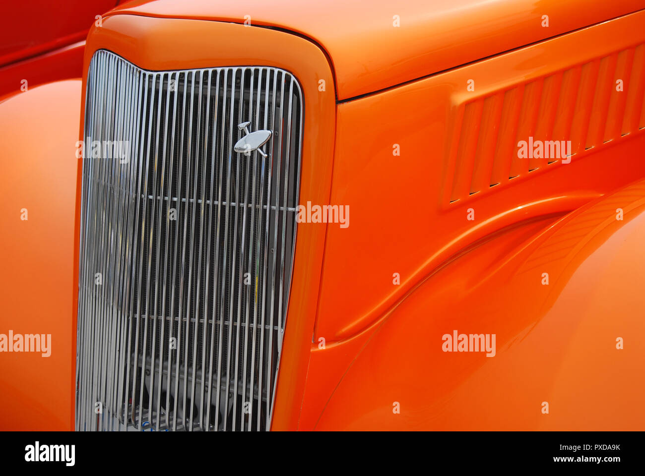 Beautiful orange color hot-rod font grill and fenders Stock Photo