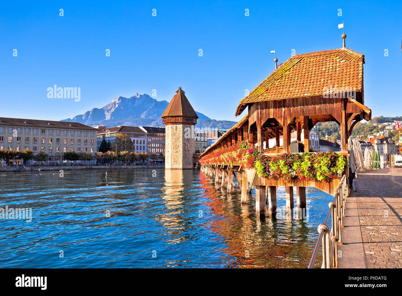 Kapellbrucke historic wooden bridge in Luzern and waterfront landmarks view, town in central Switzerland Stock Photo