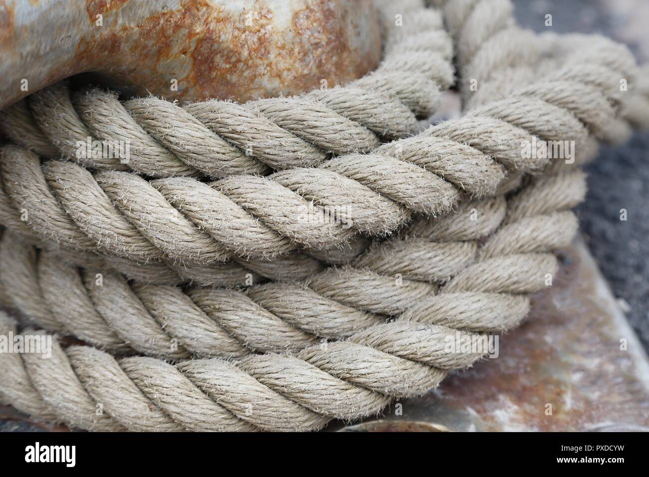 Mooring rope tied on a bitts Stock Photo - Alamy