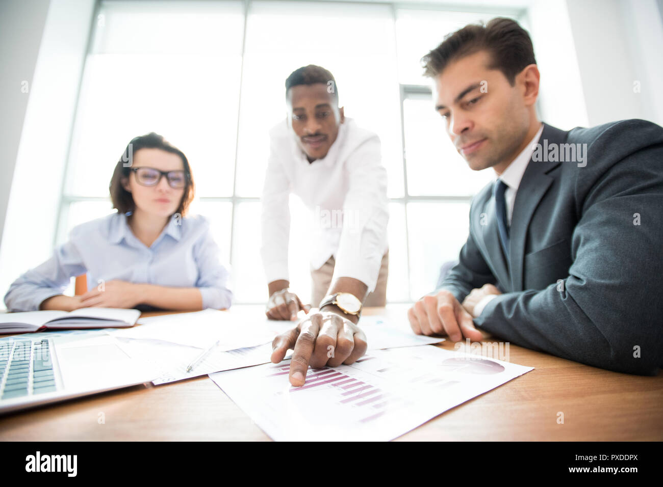 Business colleagues analyzing sales data Stock Photo