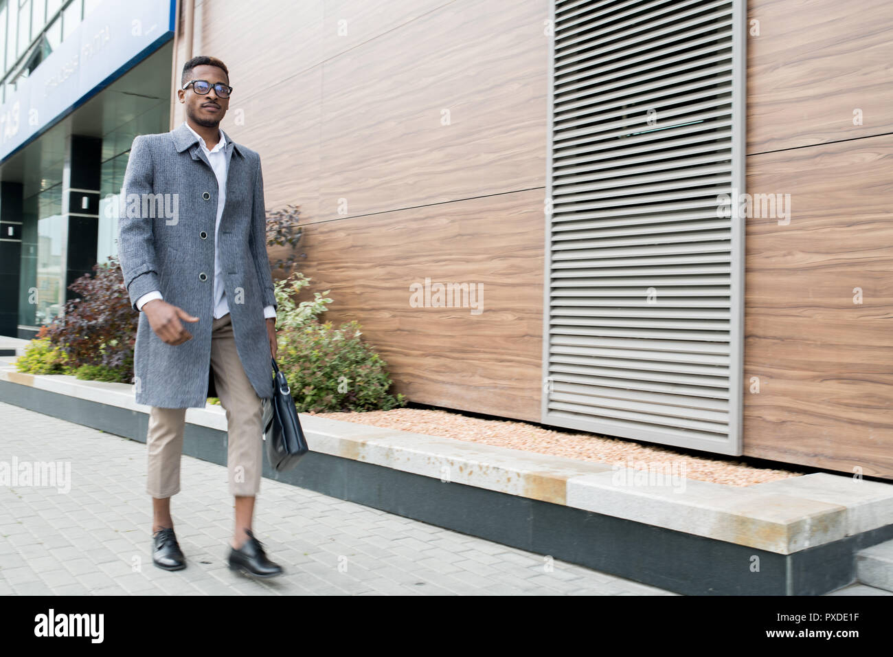 Fashionable African businessman leaving office Stock Photo