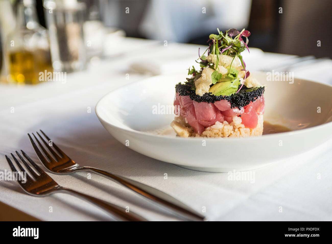 Fish, rice and caviar appetizer at upscale restaurant Stock Photo