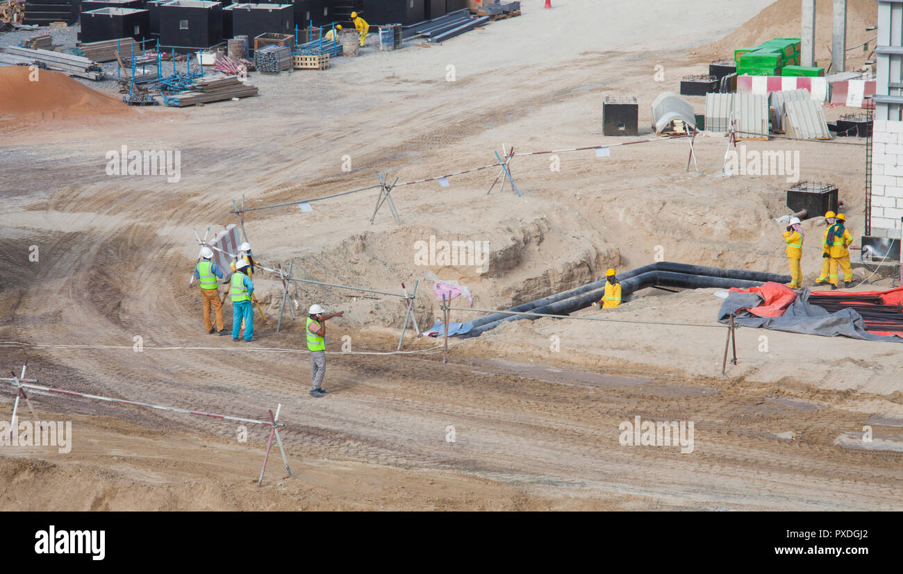 construction site with workers at pipes Stock Photo - Alamy