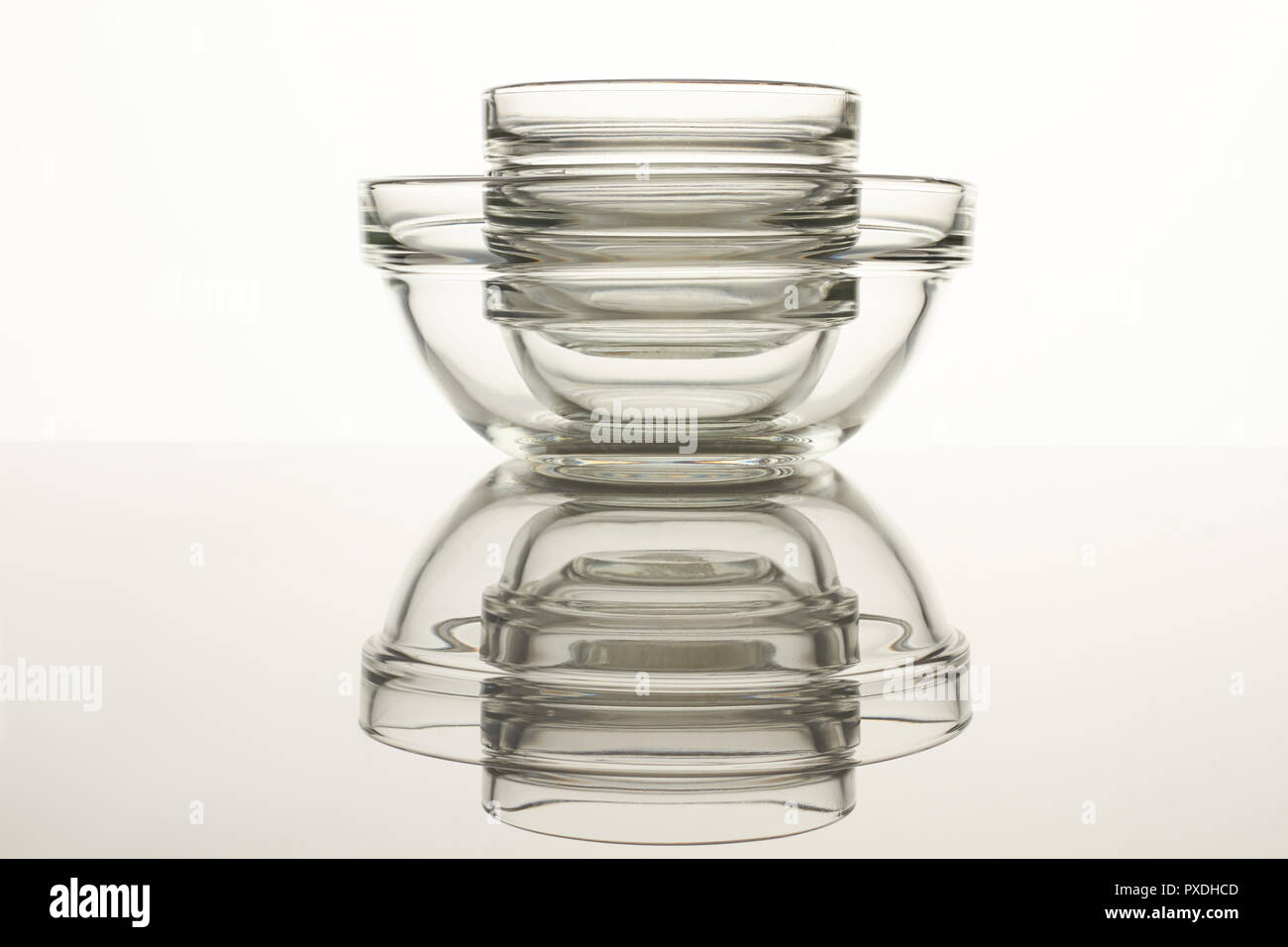 Glass utensil on reflective surface Stock Photo Alamy