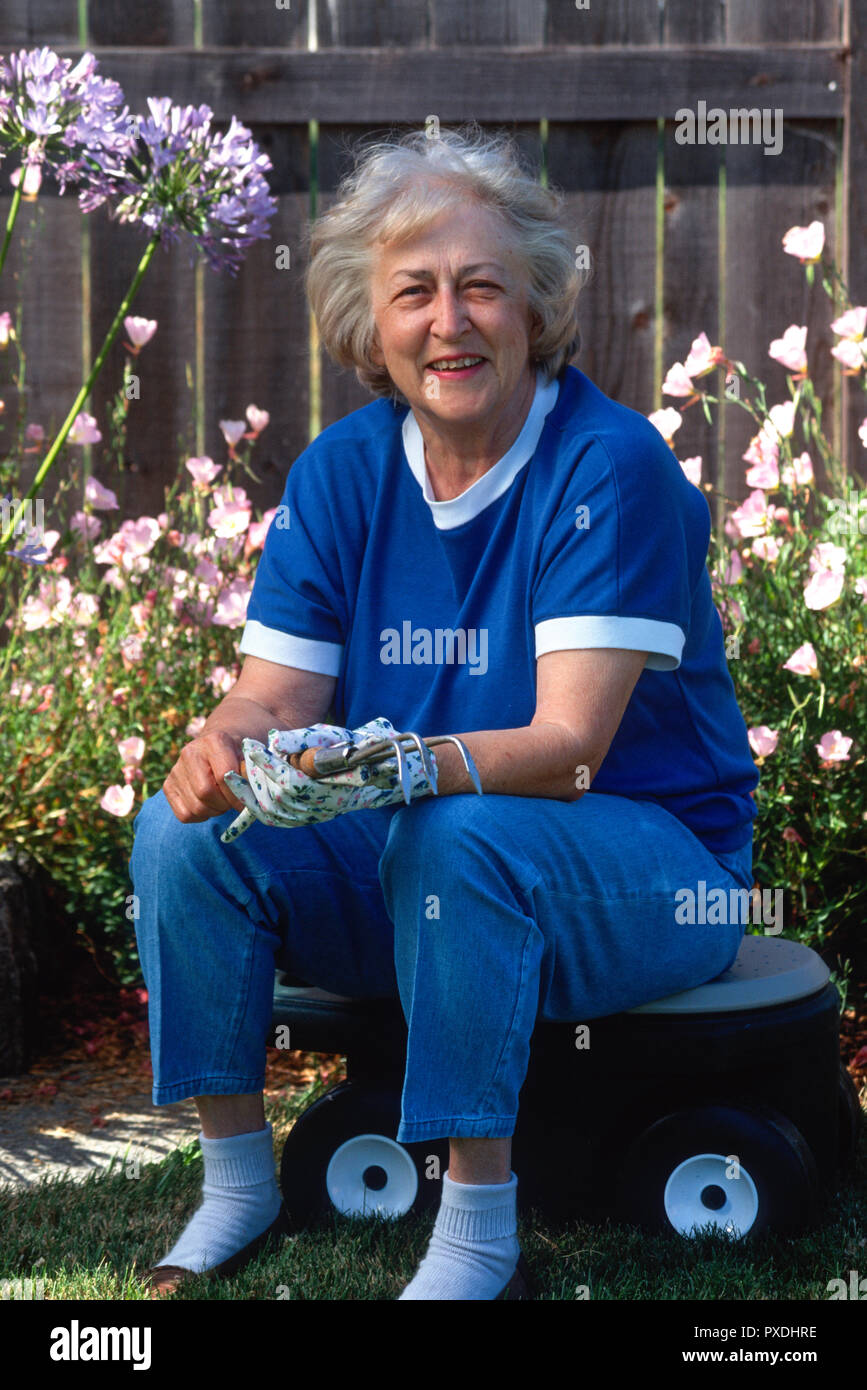 Senior woman enjoys working in her garden, USA Stock Photo - Alamy
