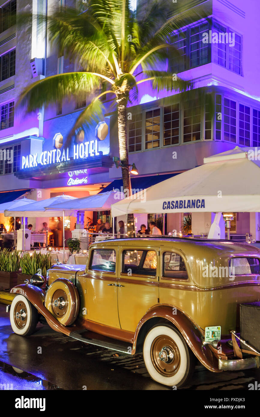 Miami Beach Florida,Ocean Drive,night evening,Park Central,hotel,car,vintage,automobile,car,white wall tire,Casablanca,1932,Packard,classic,palm tree, Stock Photo