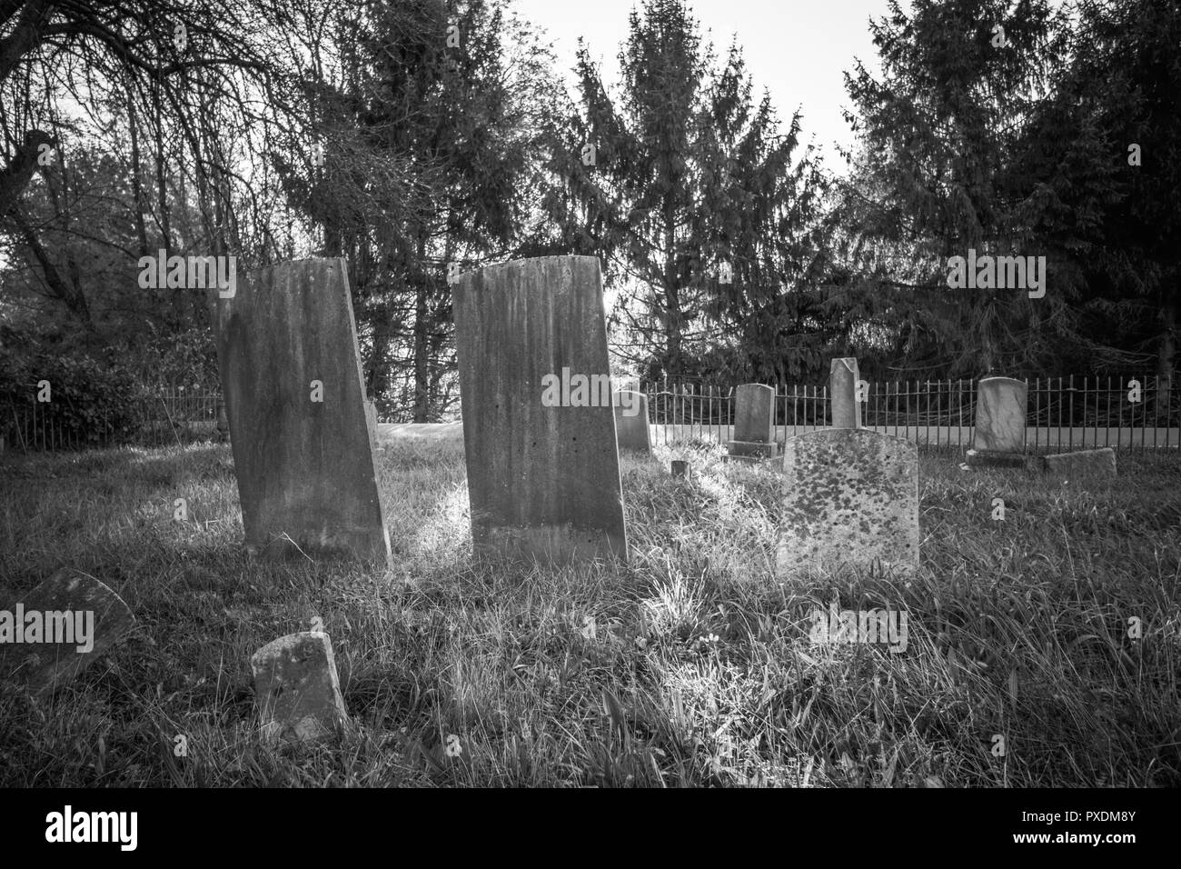 Old cemetery and tombstones in rural town of Wantage, NJ, from 1800's, black and white Stock Photo
