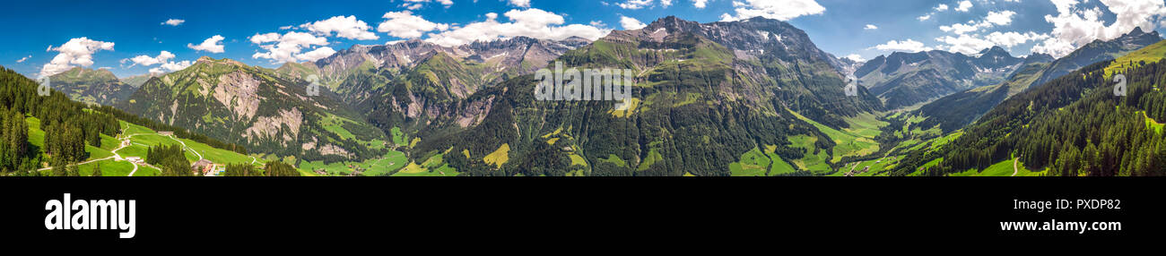 Aerial view of Elm village and Swiss mountains - Piz Segnas, Piz Sardona, Laaxer Stockli from Ampachli, Glarus, Switzerland, Europe. Stock Photo