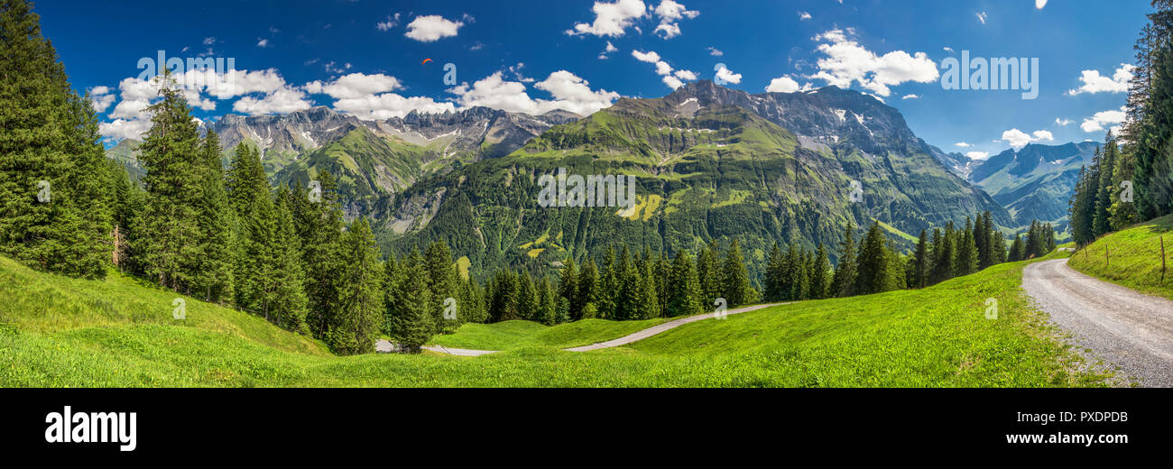 View of Elm village and Swiss mountains - Piz Segnas, Piz Sardona, Laaxer Stockli from Ampachli, Glarus, Switzerland, Europe. Stock Photo