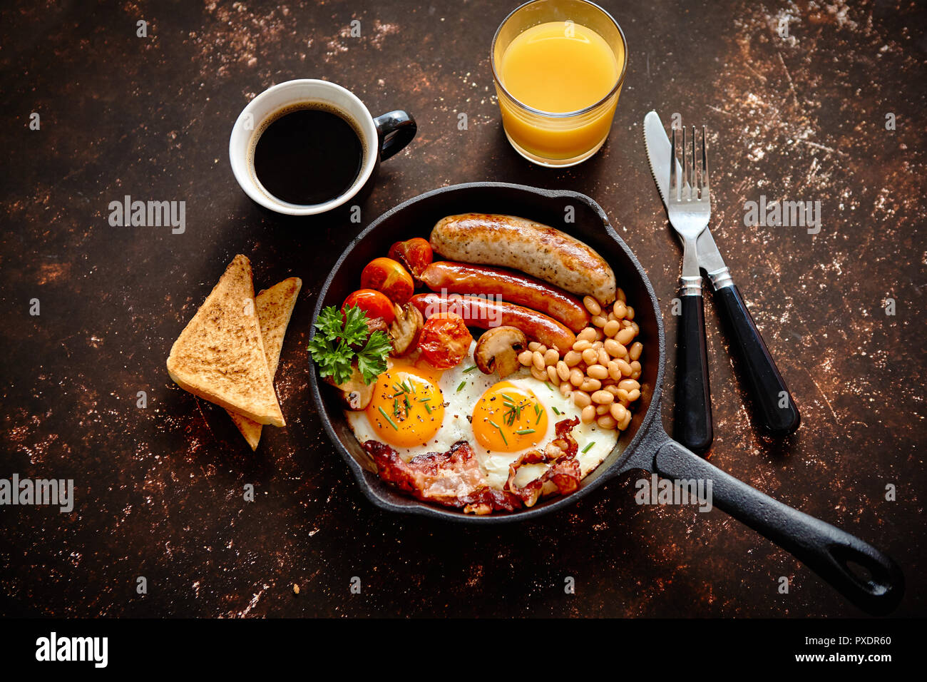 Delicious english breakfast in iron cooking pan Stock Photo Alamy