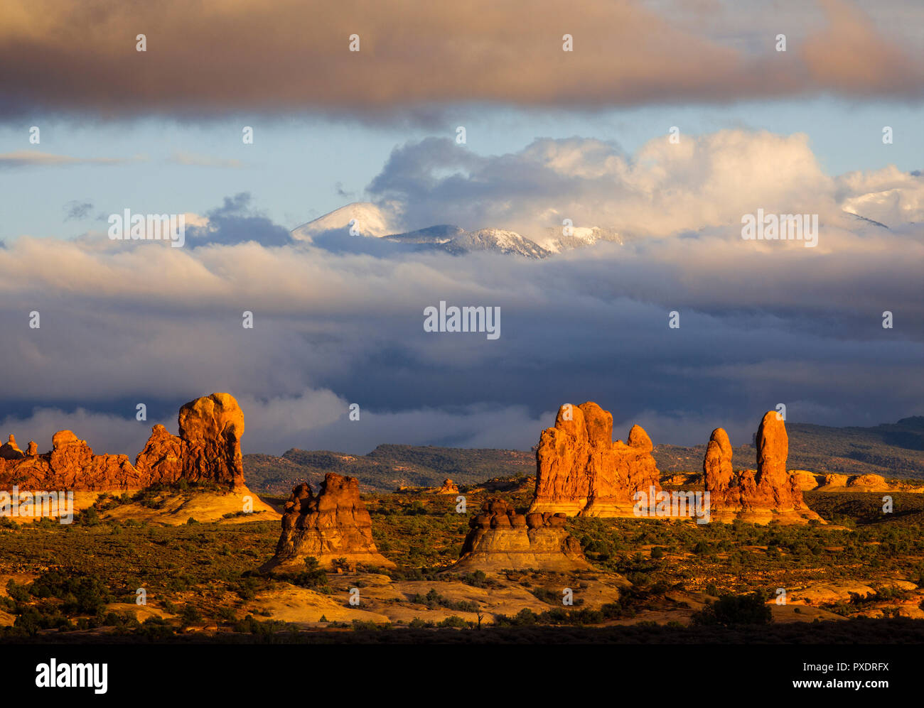 The rock formations of the Windows District of Arches National Park backed by the La Sal Mountains, Utah. Stock Photo