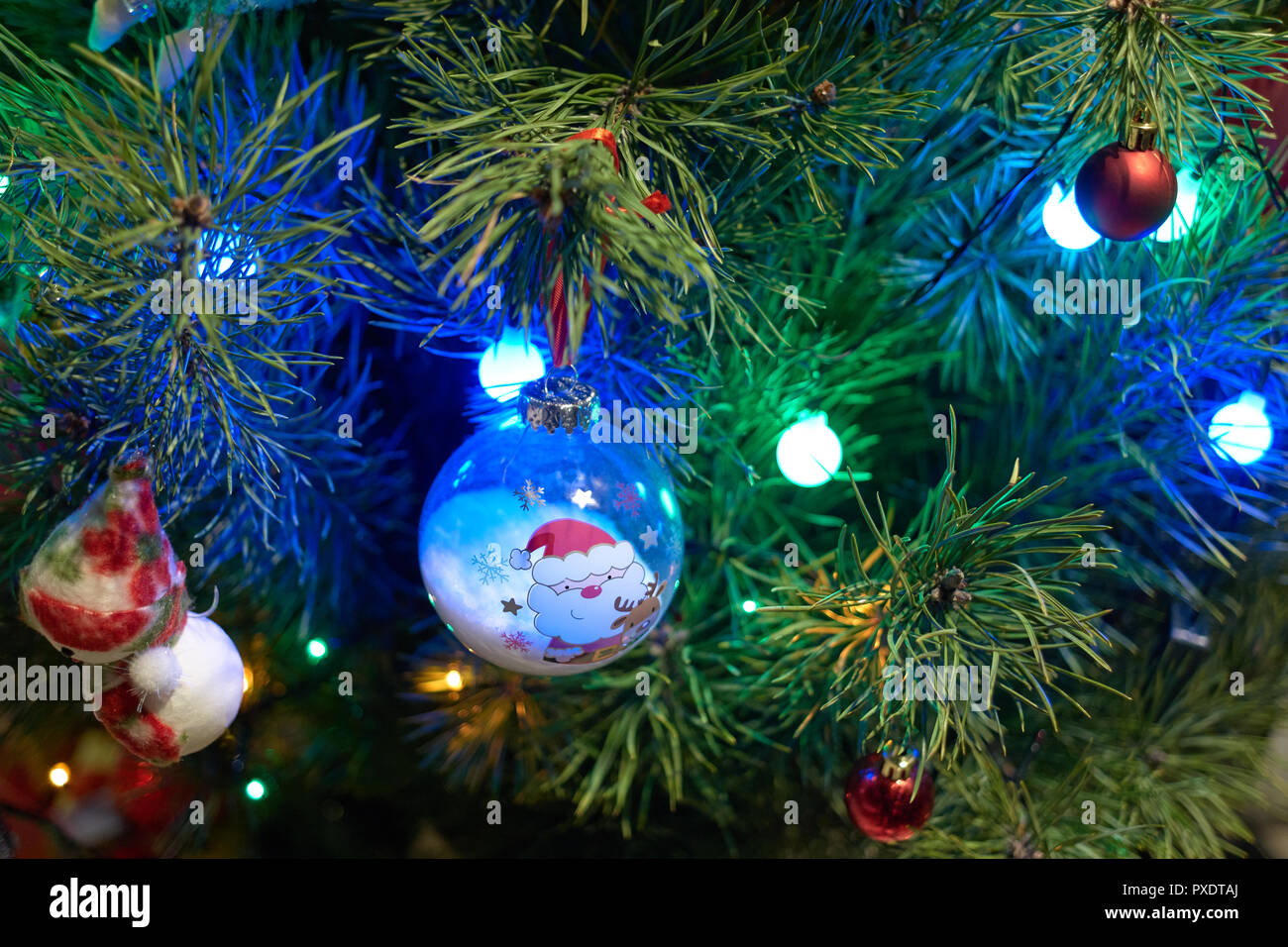 Close up of Christmas decorations hanging on tree. Stock Photo