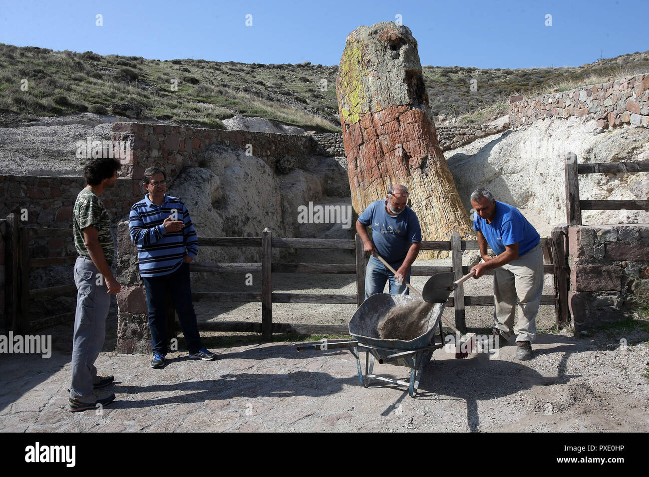 (181021) -- LESVOS ISLAND (GREECE), Oct. 21, 2018 (Xinhua) -- Nickolas Zouros (2nd L), President of the Global Geoparks Network and Director of the Natural History Museum of Lesvos Petrified Forest, speaks to workers during restoration work in the Petrified Forest near Sigri village, Lesvos island, Greece on Oct. 20, 2018. The entire Lesvos island in the northeastern Aegean Sea has been designated as one of the 140 UNESCO Global Geoparks worldwide on account of its outstanding geological, cultural and ecological heritage and efforts to preserve and promote it over the past three decades. (Xinh Stock Photo