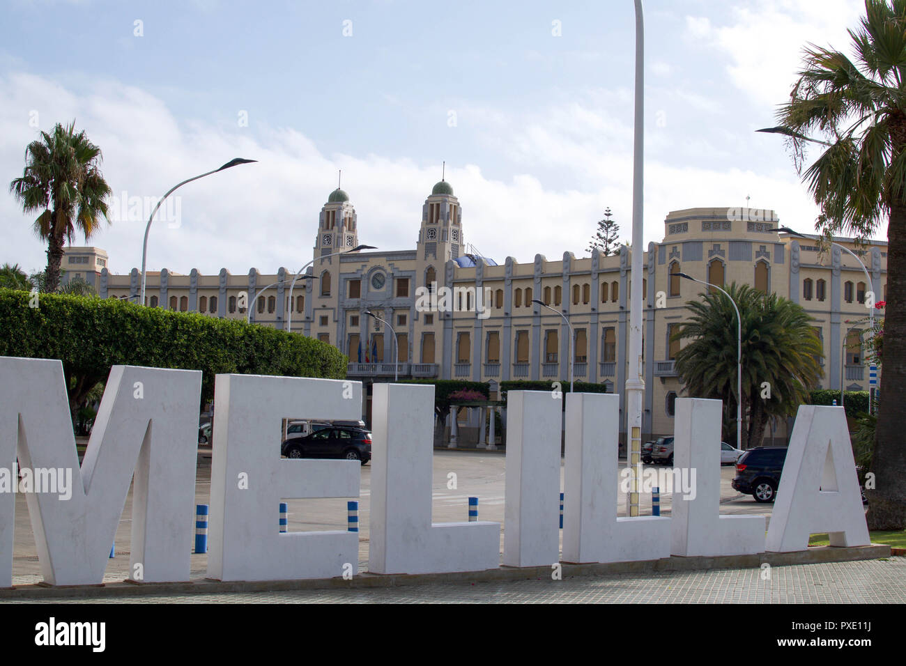 Melilla, Melilla, Spain. 18th Aug, 2018. Letters spelling out melila seen placed in the central square.The Spanish enclave city of Melilla sits on the North African coast, surrounded on all sides by Morocco and the Mediterranean Sea. The city is surrounded by a 20-foot-tall metal fence to keep out migrants looking to come to Europe, but many migrants make it across anyway. The border is also a thriving economic hub where Moroccan labourers carry goods from Spain into Morocco. Credit: SOPA Images/ZUMA Wire/Alamy Live News Stock Photo