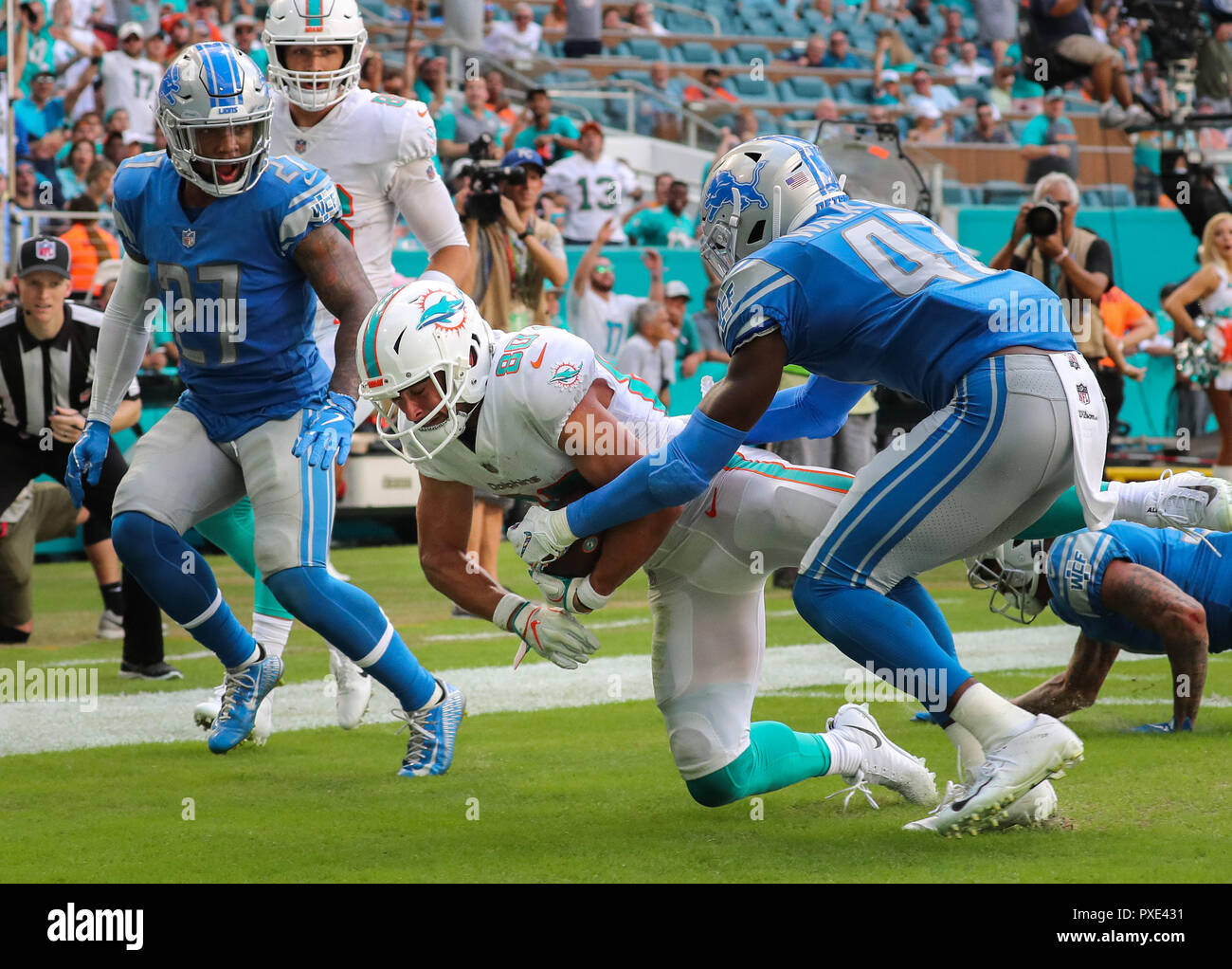 Miami Gardens, Florida, USA. 21st Oct, 2018. Miami Dolphins wide receiver Danny Amendola (80) scores a touchdown in the fourth quarter challenged by Detroit Lions defensive back Tracy Walker (47) during a NFL football game between the Detroit Lions and the Miami Dolphins at the Hard Rock Stadium in Miami Gardens, Florida. Credit: Mario Houben/ZUMA Wire/Alamy Live News Stock Photo