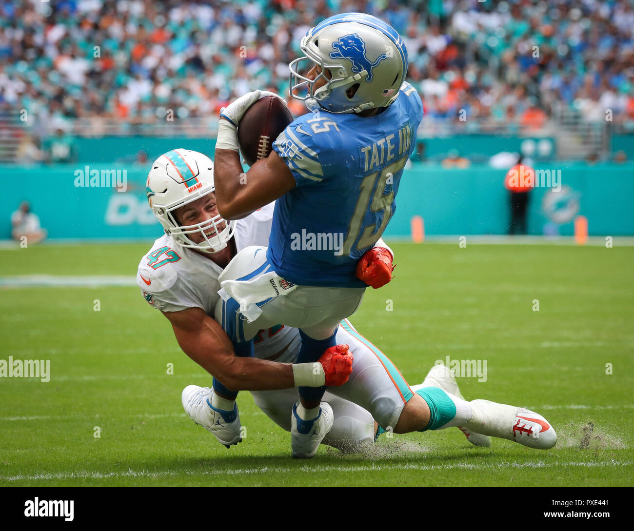 Miami Gardens, Florida, USA. 21st Oct, 2018. Detroit Lions defensive back Tracy Walker (47) holds on to a long pass as he is tackled by Miami Dolphins linebacker Kiko Alonso (47) during a NFL football game between the Detroit Lions and the Miami Dolphins at the Hard Rock Stadium in Miami Gardens, Florida. Credit: Mario Houben/ZUMA Wire/Alamy Live News Stock Photo