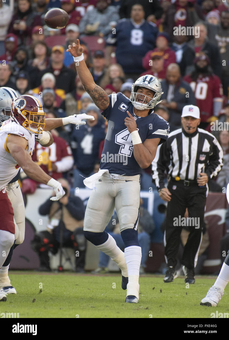 Landover, Maryland, USA. 21st Oct, 2018. Dallas Cowboys quarterback Dak Prescott (4) releases a pass early in the first quarter against the Washington Redskins at FedEx Field in Landover, Maryland on Sunday, October 21, 2018 Credit: Ron Sachs/CNP/ZUMA Wire/Alamy Live News Stock Photo